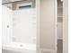 Bathroom featuring a shower with a seat and convenient built-in shelves at 46541 Sunflower Ln, Bennett, CO 80102