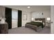 Bedroom with a cozy bed, dark drapes, and ambient lighting at 46541 Sunflower Ln, Bennett, CO 80102