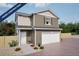 Charming two-story home with an attached garage, neutral siding, and inviting front yard landscaping at 46541 Sunflower Ln, Bennett, CO 80102