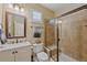 Well-maintained bathroom featuring a glass-enclosed shower, updated fixtures, and neutral tile flooring at 12015 Blackwell Way, Parker, CO 80138