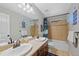 Colorful bathroom with dual sinks, granite counters and lots of storage at 12015 Blackwell Way, Parker, CO 80138