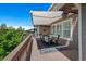 Outdoor deck featuring a dining set, retractable awning, and great natural light at 12015 Blackwell Way, Parker, CO 80138