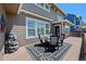 Relax on the outdoor deck with dining set, water feature, and neutral colors at 12015 Blackwell Way, Parker, CO 80138