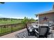 Enjoy golf course views from this outdoor deck with dining set and rock water feature at 12015 Blackwell Way, Parker, CO 80138