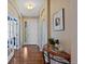 Welcoming entryway with hardwood floors, white trim, and stylish decor, creating a warm and inviting ambiance at 12015 Blackwell Way, Parker, CO 80138