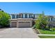 Charming two-story home featuring stone accents, three-car garage, landscaped yard, and welcoming curb appeal at 12015 Blackwell Way, Parker, CO 80138