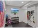 Functional home gym with equipment and TV, perfect for staying active and fit in the comfort of your home at 12015 Blackwell Way, Parker, CO 80138