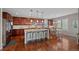 Well-appointed kitchen with granite countertops, stainless steel appliances, and a breakfast bar at 12015 Blackwell Way, Parker, CO 80138