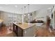 Open-concept kitchen and living room area with an island and breakfast nook at 12015 Blackwell Way, Parker, CO 80138