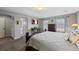 Comfortable bedroom boasts soft carpet, tray ceiling, TV, and ensuite access at 12015 Blackwell Way, Parker, CO 80138