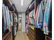 Spacious walk-in closet with custom built-in shelving and ample storage space at 12015 Blackwell Way, Parker, CO 80138