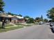 Residential street view of neighborhood with single-Gathering homes and mature trees at 1415 Raleigh St, Denver, CO 80204