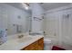 Neat bathroom featuring a marble countertop vanity, a tub, and a shower for all bathing needs at 11115 E Alameda Ave # 201, Aurora, CO 80012