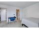 Bright bedroom with modern decor, carpet, and ensuite bathroom at 11115 E Alameda Ave # 201, Aurora, CO 80012