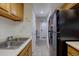 Functional kitchen with a view to the entry and modern appliances, offering a practical layout at 11115 E Alameda Ave # 201, Aurora, CO 80012
