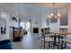 Cozy living room featuring a fireplace and hardwood floors, leading to a sunny balcony at 11115 E Alameda Ave # 201, Aurora, CO 80012
