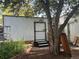 The house features a backyard shed with white wooden siding and an adjacent area for planting and gardening at 36 N Logan St, Denver, CO 80203