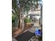 The house features a lovely backyard with a patio area, canopy and a mix of stone and mulch ground cover at 36 N Logan St, Denver, CO 80203