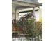 Charming porch adorned with climbing red roses and classic architectural details at 36 N Logan St, Denver, CO 80203