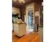 Functional kitchen with wooden floors, a central island, and access to a pantry at 36 N Logan St, Denver, CO 80203