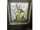 Close-up of a stained glass window featuring floral designs, adding charm and character to the home at 36 N Logan St, Denver, CO 80203