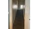 Carpeted staircase leading to the upper level, bathed in natural light from a stained glass window at 36 N Logan St, Denver, CO 80203