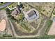 Bird's-eye view of a property featuring a house, outbuildings, and surrounding farmland, highlighting the privacy at 6646 S Fundy Ct, Centennial, CO 80016