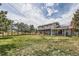 Expansive backyard with a lush lawn, mature trees, and a cozy pergola, perfect for relaxation at 6646 S Fundy Ct, Centennial, CO 80016