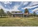 Spacious backyard featuring a well-maintained lawn, a pergola, and an inviting hot tub at 6646 S Fundy Ct, Centennial, CO 80016