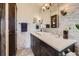 Stylish bathroom with decorative tile, vanity, modern fixtures, and ample cabinet space at 6646 S Fundy Ct, Centennial, CO 80016