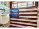 Bathroom featuring a red, white, and blue American flag design and a urinal at 6646 S Fundy Ct, Centennial, CO 80016