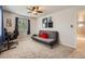 Bedroom featuring a futon, a desk, neutral colors, and a view of the outside at 6646 S Fundy Ct, Centennial, CO 80016