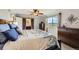 Bedroom with decorative barn door to bathroom and window with neighborhood views at 6646 S Fundy Ct, Centennial, CO 80016