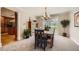 Dining room with stylish chandelier, large window and view of the backyard at 6646 S Fundy Ct, Centennial, CO 80016