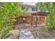 Charming brick home with covered entryway and pergola, stone steps and walkway at 6646 S Fundy Ct, Centennial, CO 80016