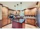 Well-equipped kitchen with custom cabinets, an island and stainless steel appliances at 6646 S Fundy Ct, Centennial, CO 80016