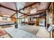 Large game room equipped with stage, fireplace, ping pong table, bar and lounge area at 6646 S Fundy Ct, Centennial, CO 80016
