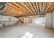 Unfinished basement ready for customization with exposed ceiling and concrete floors at 806 Peony Ct, Brighton, CO 80601