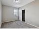 Clean bedroom with plush carpet, closet with sliding doors, and neutral paint scheme at 806 Peony Ct, Brighton, CO 80601