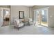 Bright sitting room showcasing modern decor and a large sliding glass door to the outside at 806 Peony Ct, Brighton, CO 80601