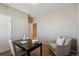 Cozy home office featuring a dark desk, comfortable chair, and neutral walls at 806 Peony Ct, Brighton, CO 80601