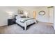 Bright bedroom showcasing a comfortable bed, a nightstand, and soft, neutral tones at 32 Eagle Dr, Littleton, CO 80123