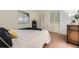 Comfortable bedroom with a closet, an area rug, soft carpet, and lots of natural light at 32 Eagle Dr, Littleton, CO 80123