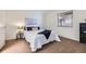 Bright bedroom featuring soft carpet, closet doors, and a view to the entry at 32 Eagle Dr, Littleton, CO 80123