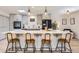 Updated kitchen with gray cabinets, large center island with gas range, and pendant lighting, a chef's dream space at 32 Eagle Dr, Littleton, CO 80123
