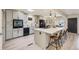 Beautiful kitchen with gray cabinets, a large island, and a stylish design, perfect for cooking and gathering at 32 Eagle Dr, Littleton, CO 80123