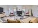 Bright living room featuring a decorative fireplace, modern decor, and lots of natural light at 32 Eagle Dr, Littleton, CO 80123