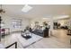 Open living space showcasing the living room, dining area, and kitchen with modern appliances at 32 Eagle Dr, Littleton, CO 80123