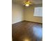 A bedroom with hardwood floors, a ceiling fan, and a window with blinds at 18193 E Kentucky Ave # 201, Aurora, CO 80017