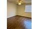 A bedroom with hardwood floors, a ceiling fan, and a window with blinds at 18193 E Kentucky Ave # 201, Aurora, CO 80017